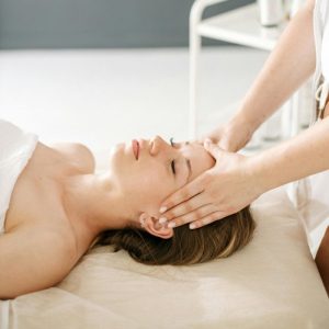 Calm and rejuvenating head massage therapy session with a relaxing ambiance.